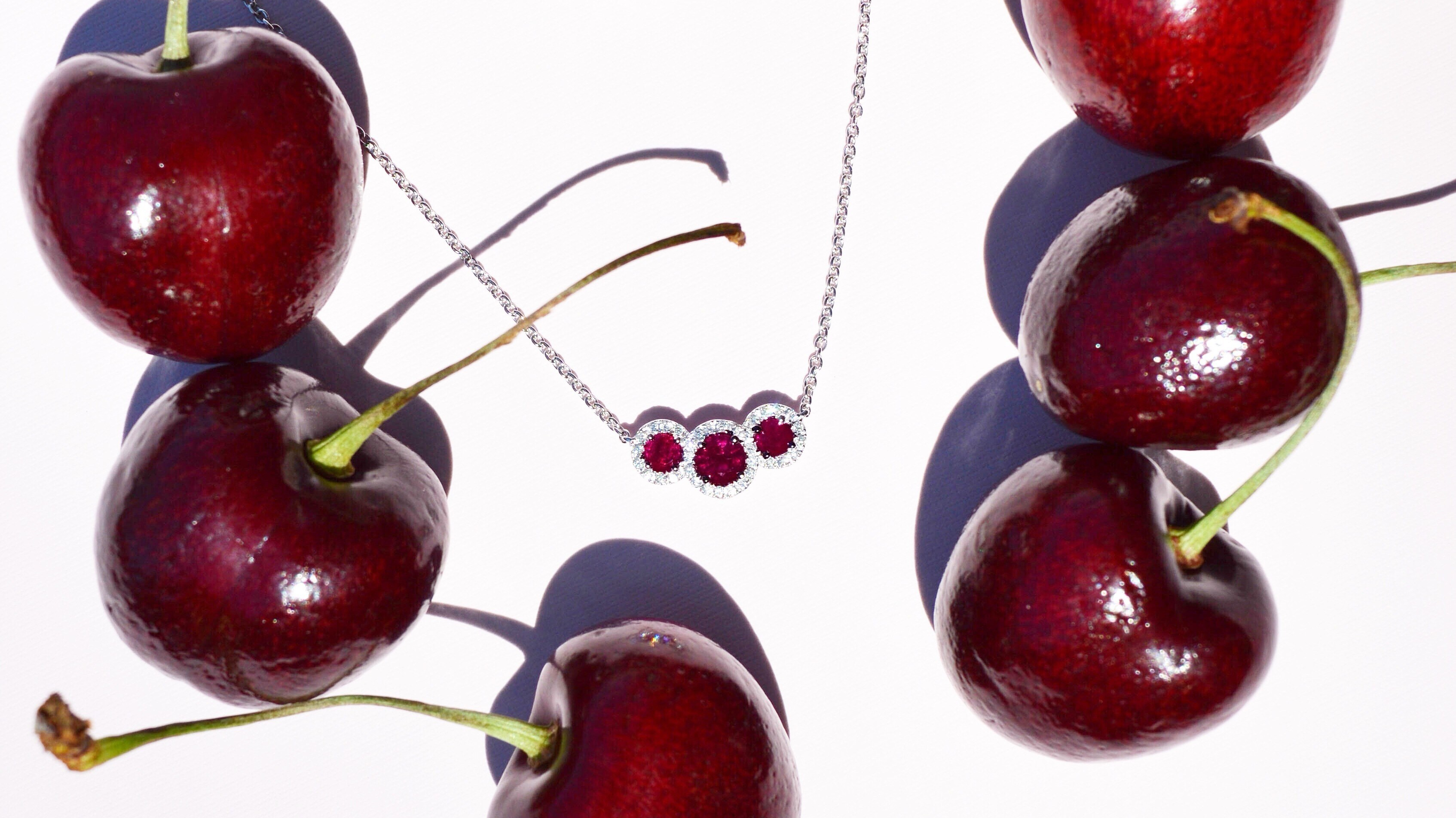 ruby-three-stone-necklace-cherries-michaels-jewelers.jpg