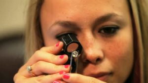 stock-footage-store-jeweler-looking-at-a-diamond